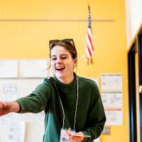 Student instructing children in the classroom